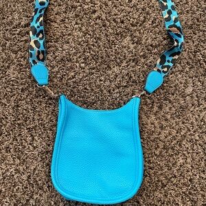 Teal leather purse with teal leopard strap